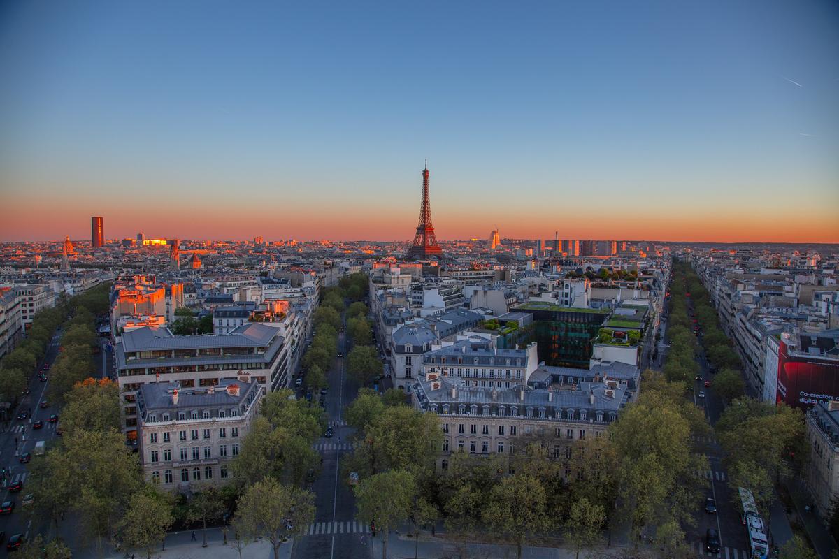 Paris skyline with Eiffel Tower at sunset from Arc de Triomphe