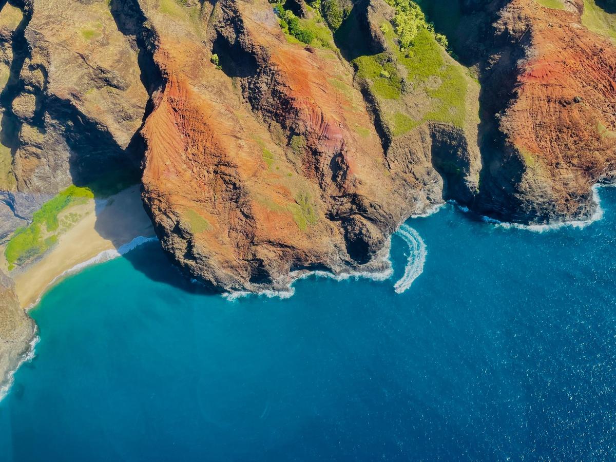 boat exiting sea cave